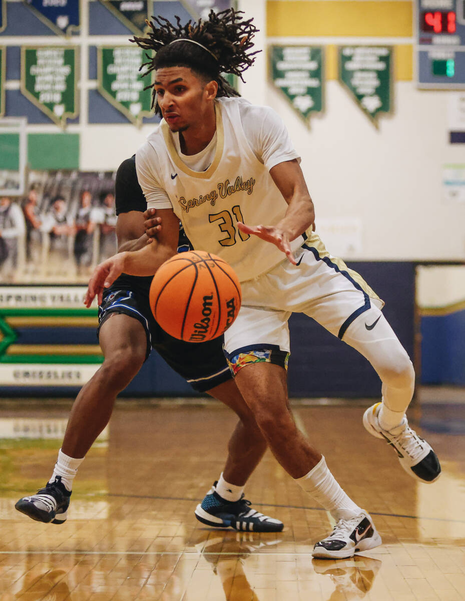 Spring Valley point guard Alijah Adem (31) struggles to keep the ball during a game against Des ...