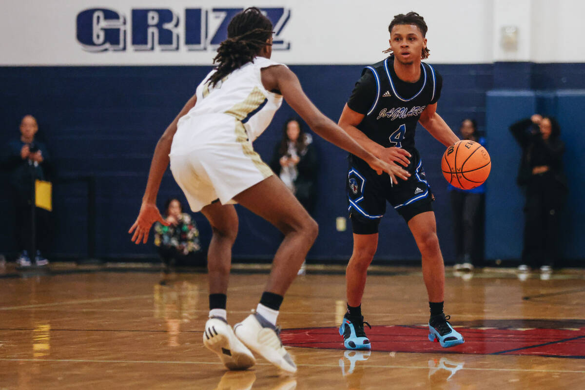 Desert Pines guard Prince Davis (4) dribbles the ball down the court during a game at Spring Va ...