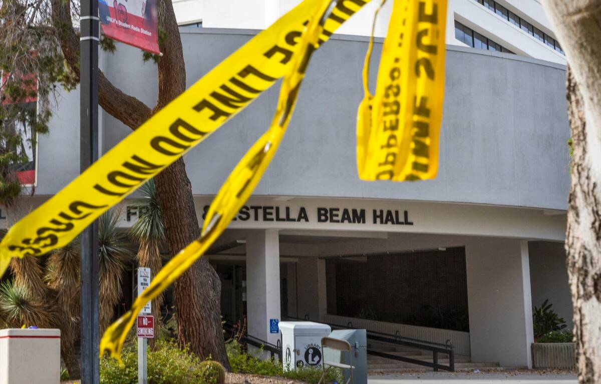Police tape remains on a tree outside the entrance to the Frank and Estella Beam Hall on the UN ...