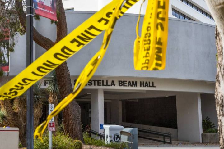 Police tape remains on a tree outside the entrance to the Frank and Estella Beam Hall on the UN ...