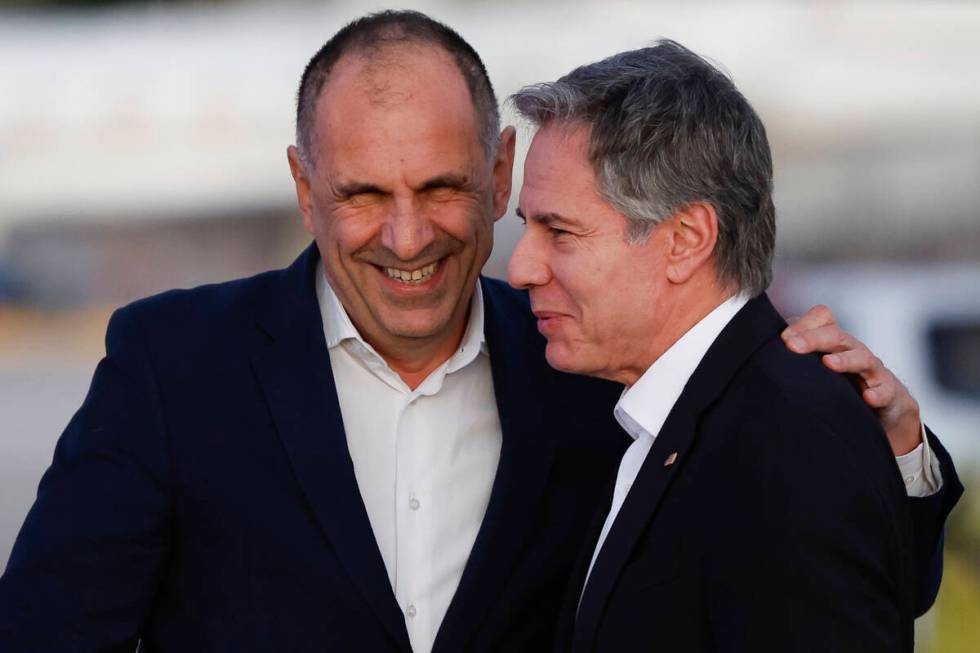 Greek Foreign Minister George Gerapetritis, left, greets U.S. Secretary of State Antony Blinken ...