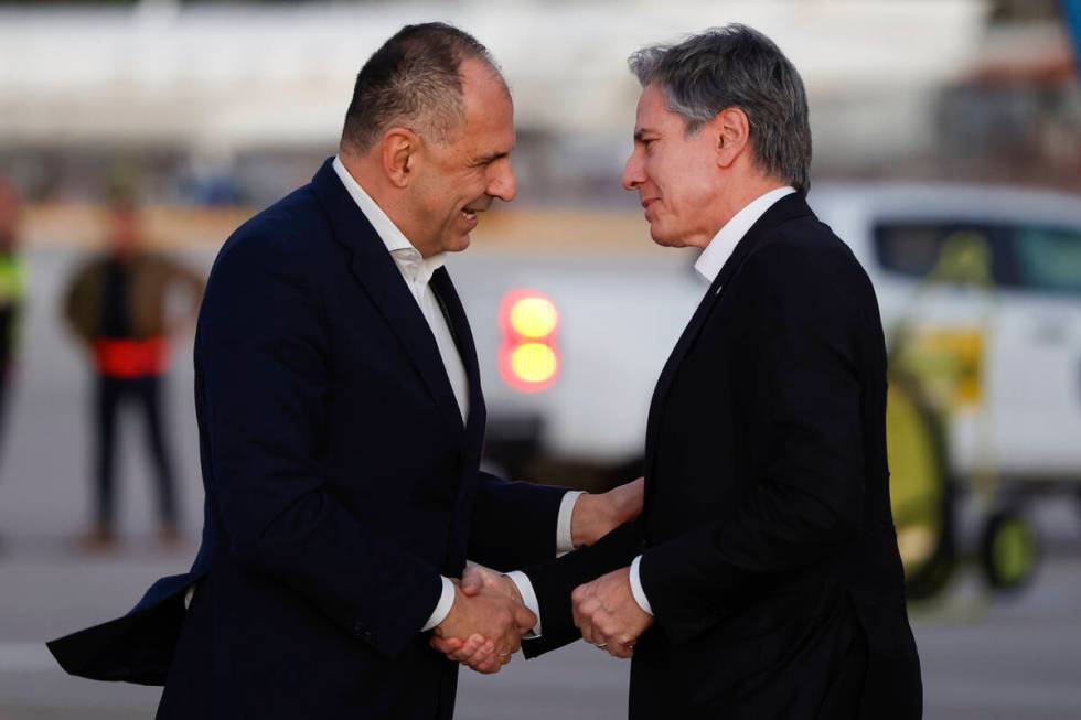 Greek Foreign Minister George Gerapetritis, left, greets U.S. Secretary of State Antony Blinken ...