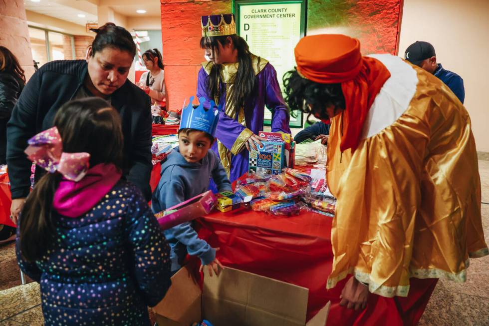 The Three Wise Men pass out toys to children during a Clark County celebration for Three Kings ...