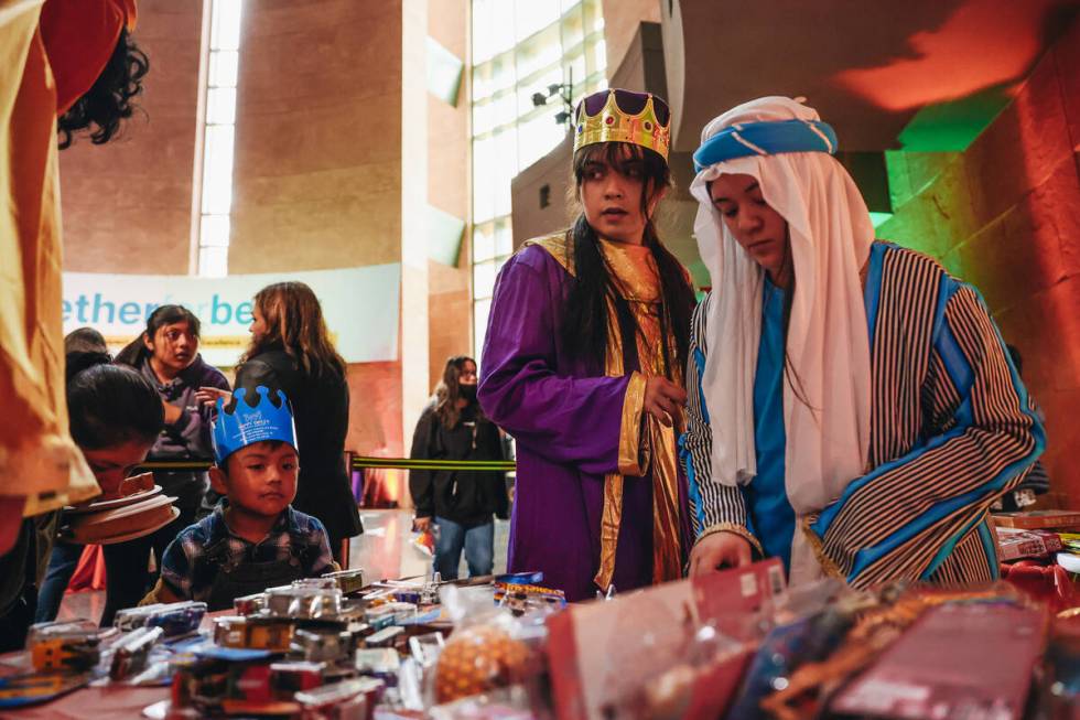 The Three Wise Men pass out toys to children during a Clark County celebration for Three Kings ...