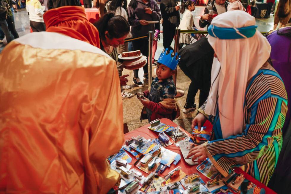 The Three Wise Men pass out toys to children during a Clark County celebration for Three Kings ...