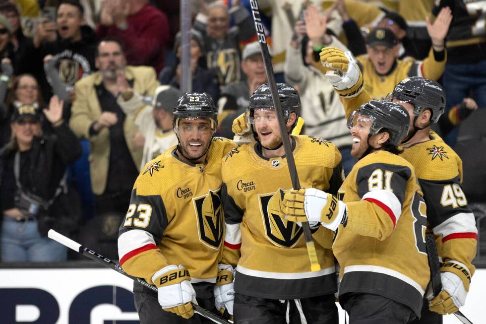 Golden Knights defenseman Alec Martinez (23), center Jack Eichel (9), right wing Jonathan March ...