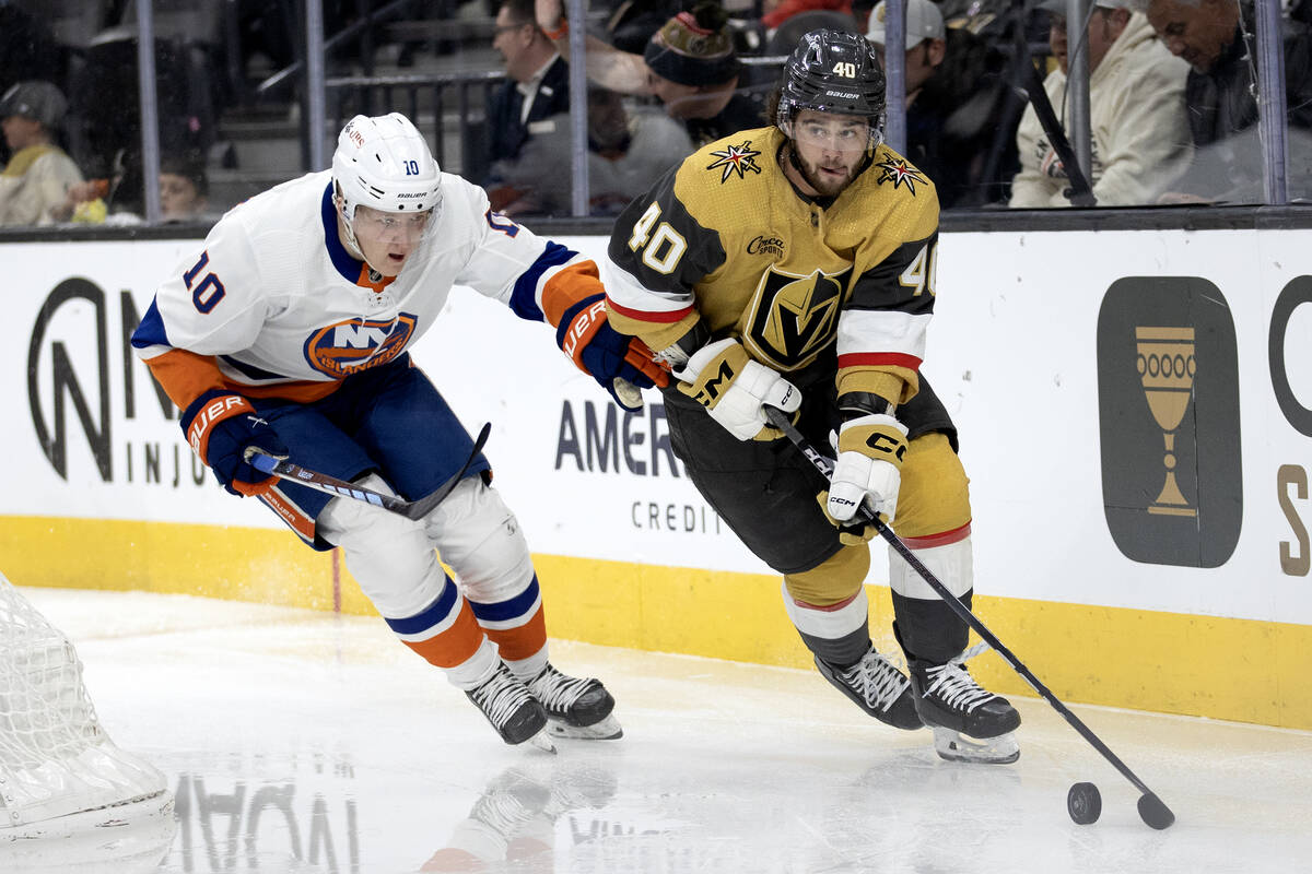 Golden Knights defenseman Lukas Cormier (40) brings the puck around the net against Islanders r ...