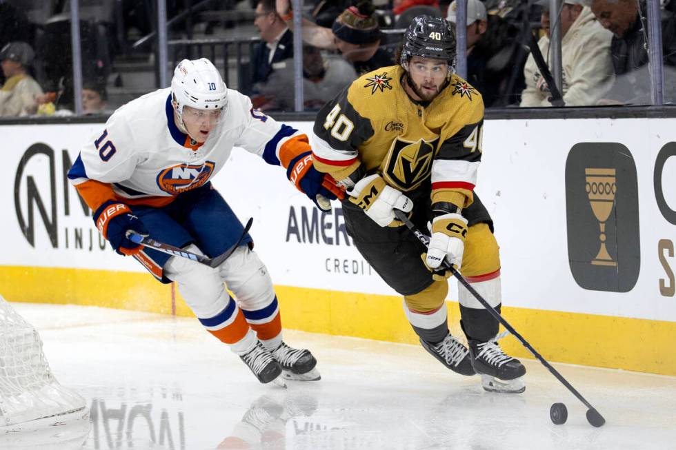 Golden Knights defenseman Lukas Cormier (40) brings the puck around the net against Islanders r ...