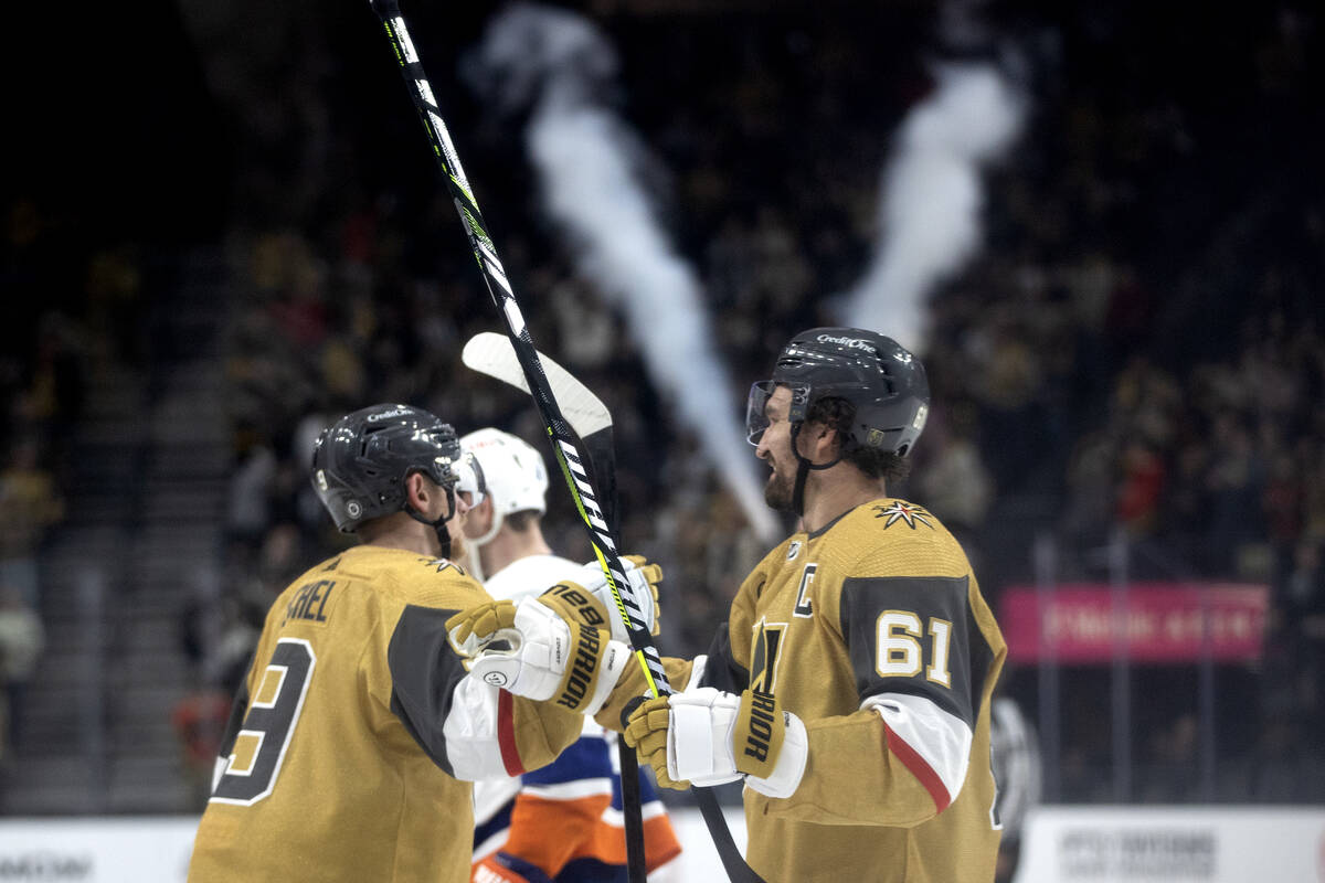 Golden Knights center Jack Eichel (9) and right wing Mark Stone (61) celebrate Eichel’s ...