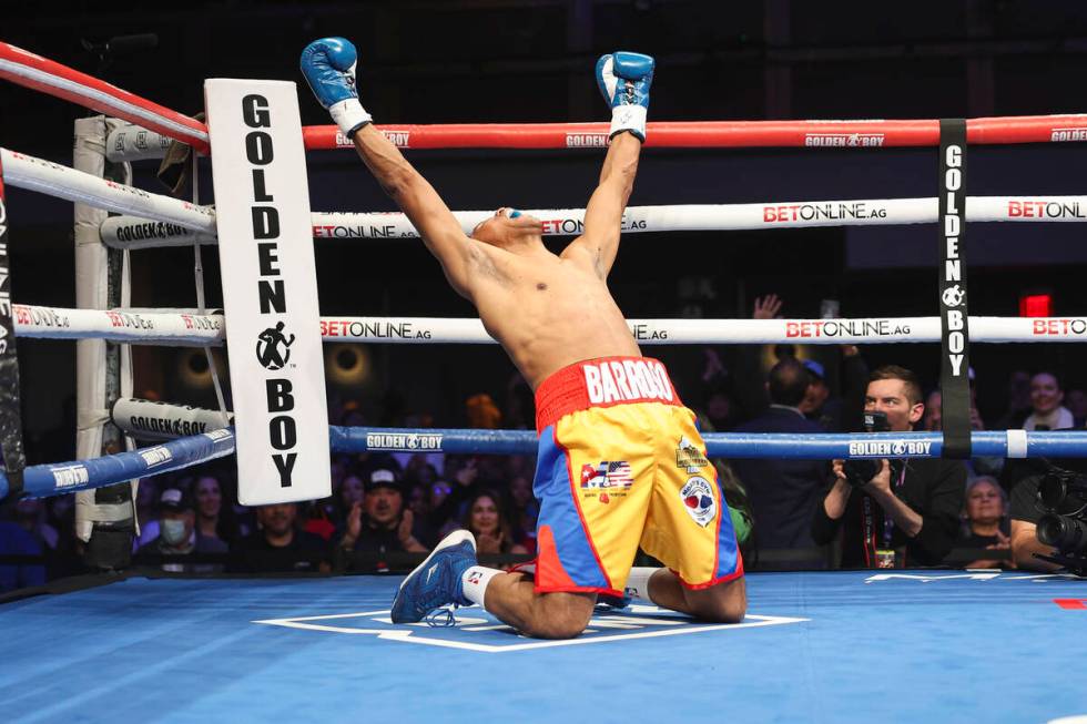 Ismael Barroso drops to his knees to celebrate his victory over Ohara Davies in their WBA inter ...