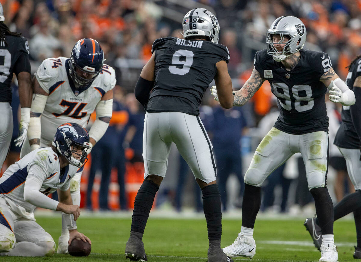 Raiders defensive end Tyree Wilson (9) celebrates his sack of Denver Broncos quarterback Jarret ...