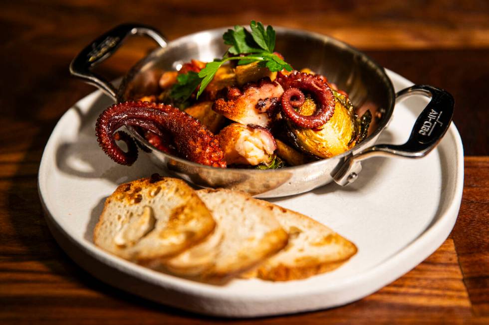 Flambéed octopus is pictured at Casa de Raku, a tapas bar, on Tuesday, Jan. 9, 2024, in La ...