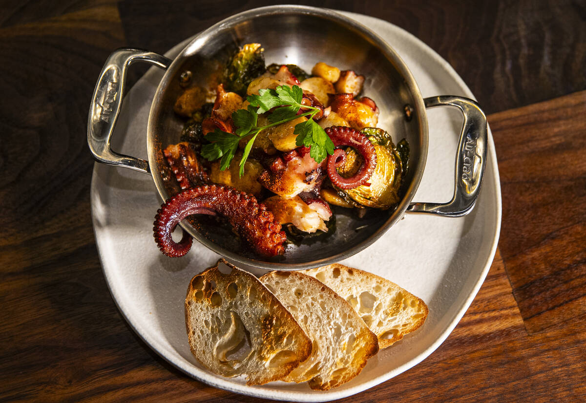 Flambéed octopus is pictured at Casa de Raku, a tapas bar, on Tuesday, Jan. 9, 2024, in La ...