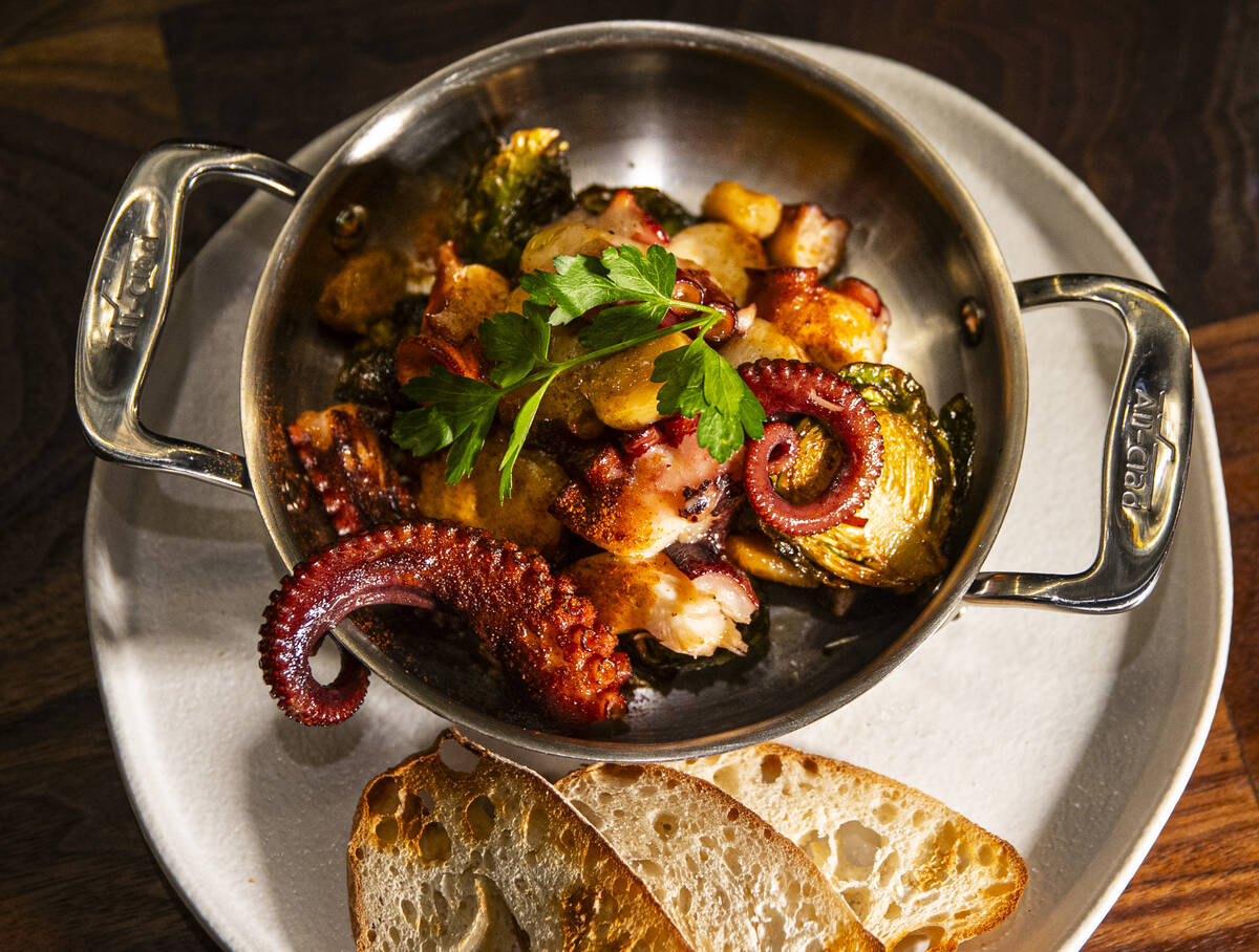 Flambéed octopus is pictured at Casa de Raku, a tapas bar, on Tuesday, Jan. 9, 2024, in La ...