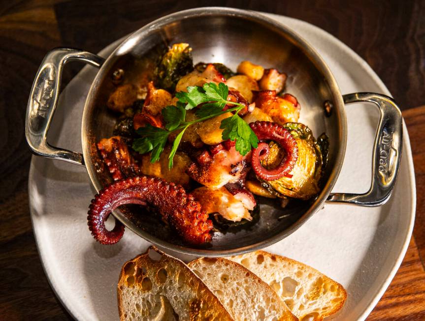 Flambéed octopus is pictured at Casa de Raku, a tapas bar, on Tuesday, Jan. 9, 2024, in La ...