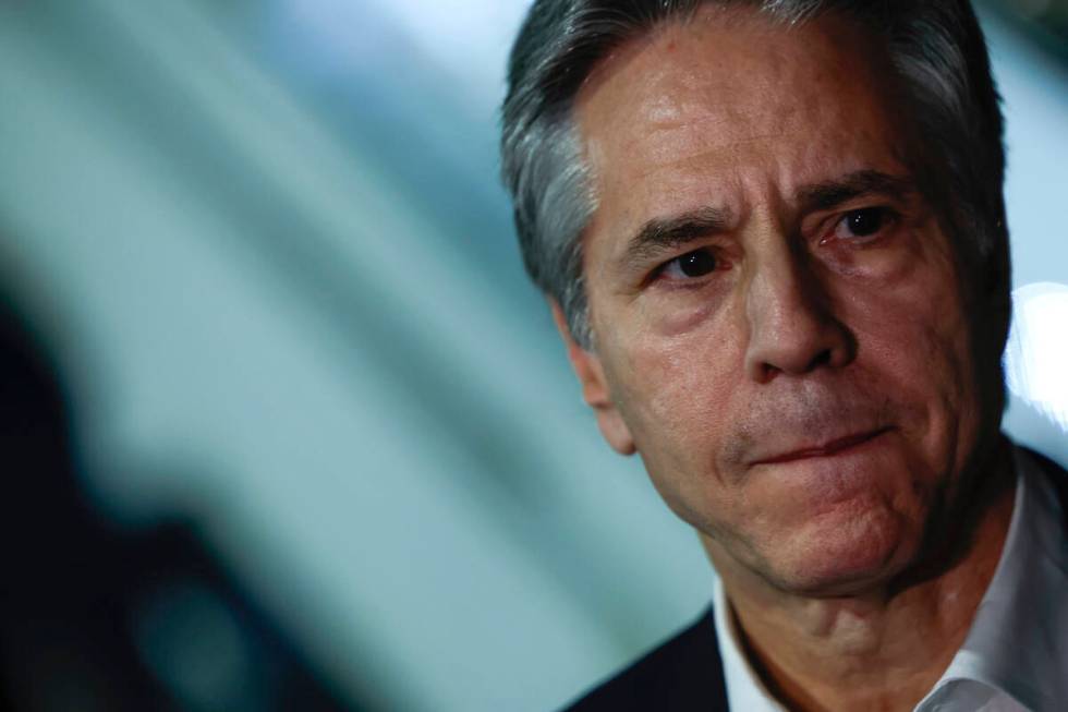 U.S. Secretary of State Antony Blinken looks on as he speaks to the media, during his week-long ...