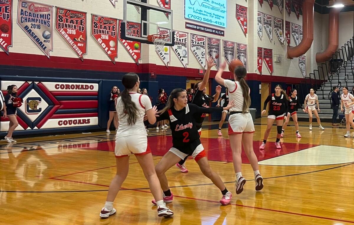 Coronado's girls basketball team takes a 3-pointer during its 63-49 loss to Liberty on Jan. 8, ...