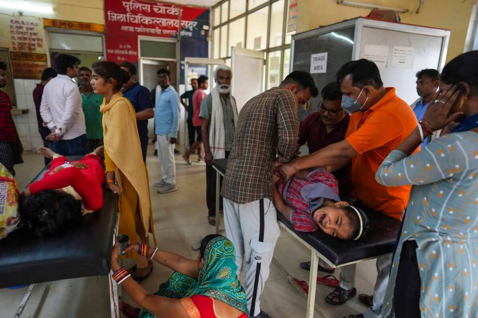 People suffering from heat related ailments crowd the district hospital in Ballia, Uttar Prades ...