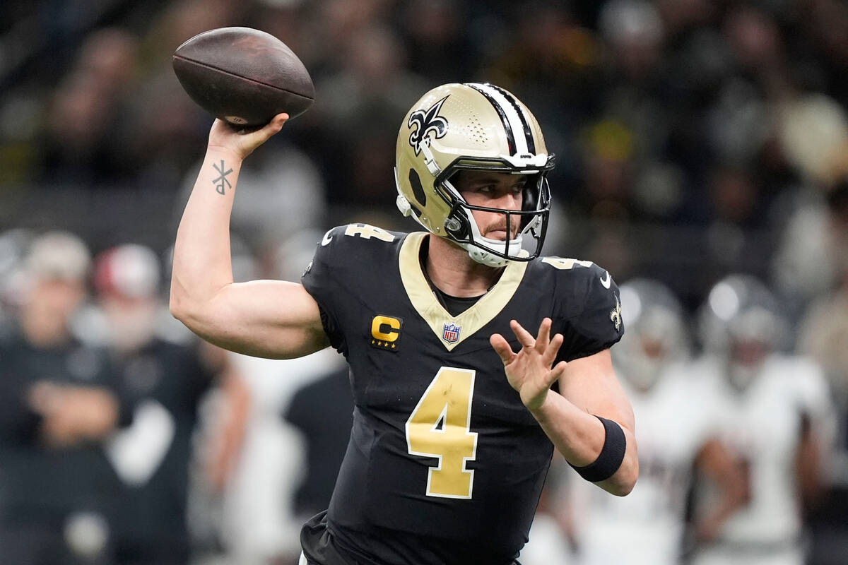 New Orleans Saints quarterback Derek Carr (4) sets back to pass in the first half of an NFL foo ...