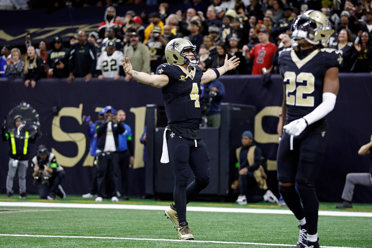 New Orleans Saints quarterback Derek Carr (4) celebrates after a touchdown during an NFL footba ...