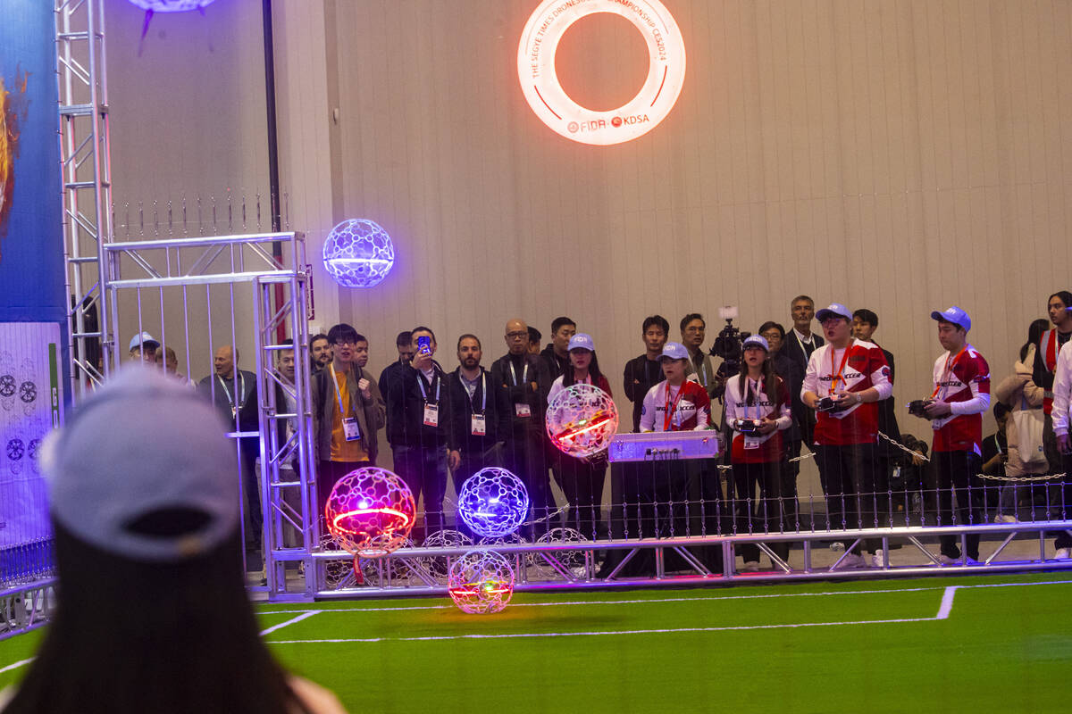 People compete in drone soccer during the first day of CES at the Las Vegas Convention Center o ...