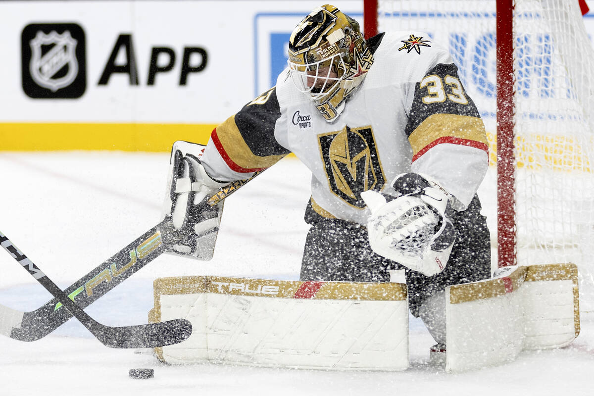 Golden Knights goaltender Adin Hill (33) makes a save during the second period of an NHL hockey ...