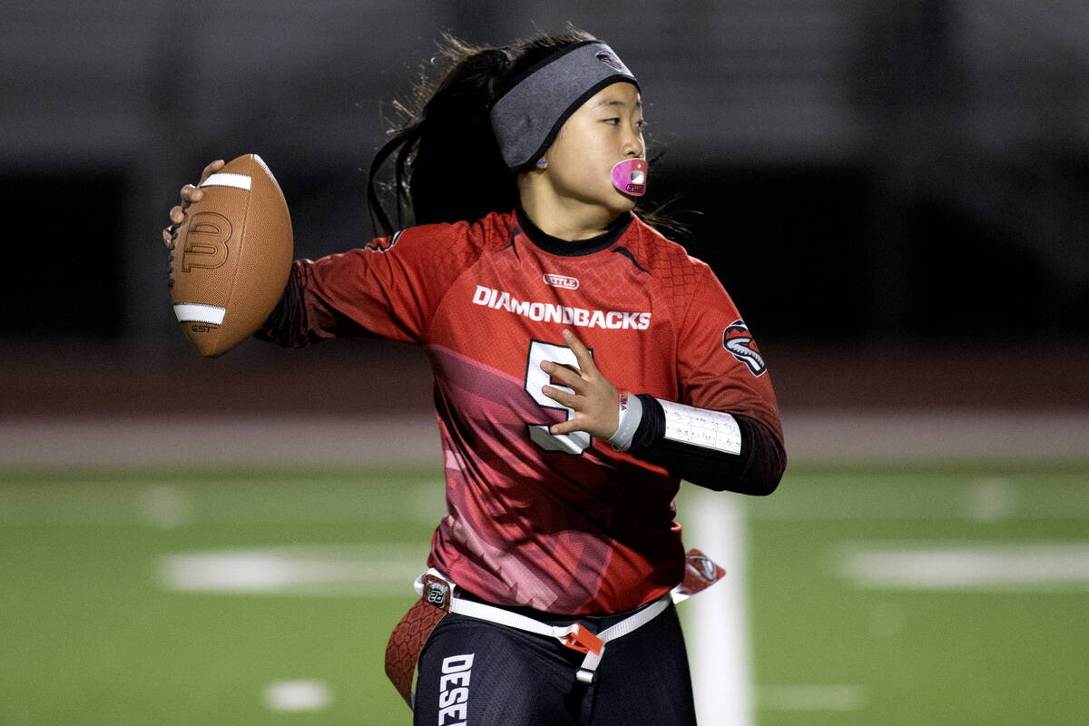 Desert Oasis quarterback Akemi Higa (5) looks to pass during a high school flag football game a ...