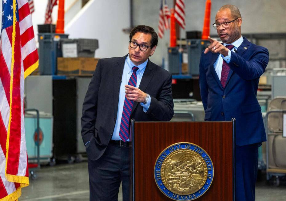 Nevada Secretary of State Francisco Aguilar, left, and Attorney General Aaron Ford ask for anot ...