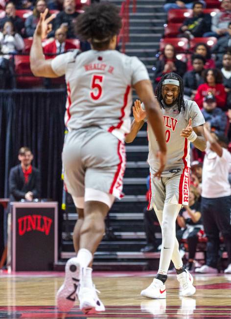 UNLV forward Keylan Boone (20) is pumped up after forward Rob Whaley Jr. (5) sinks a 3-point ba ...