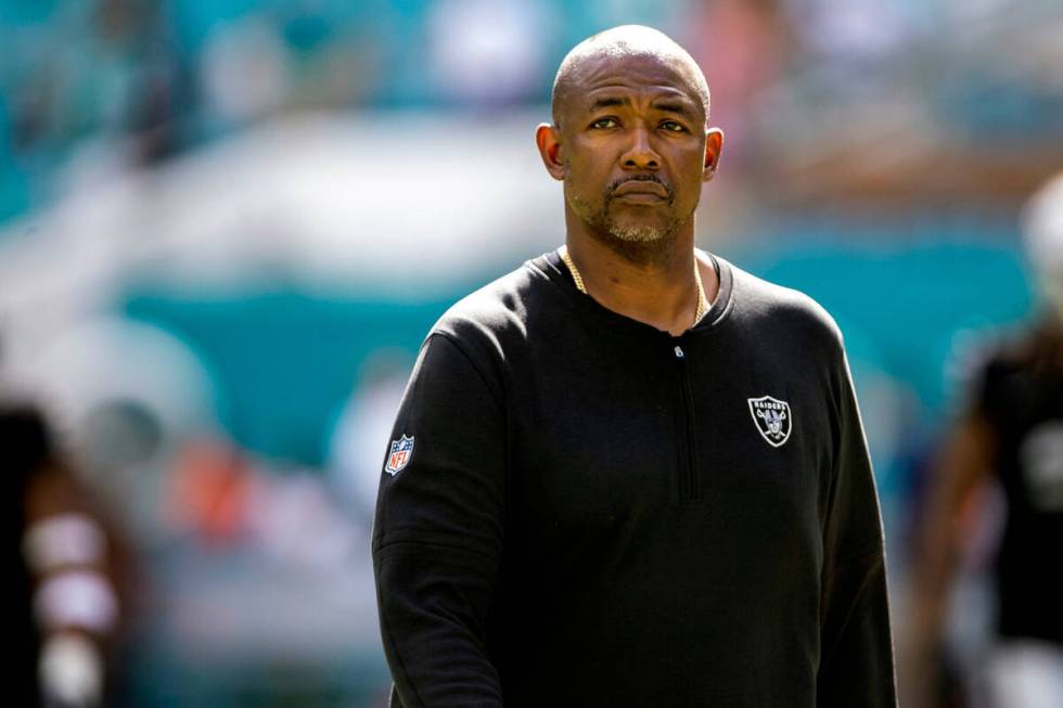 Raiders defensive coordinator Patrick Graham walks on the field before an NFL game against the ...