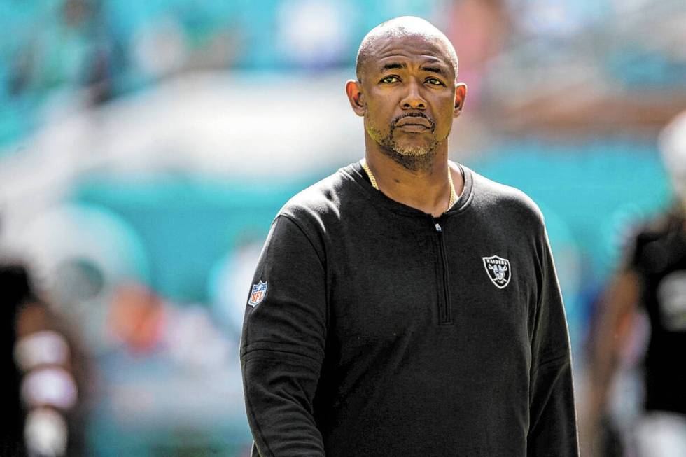 Raiders defensive coordinator Patrick Graham walks on the field before an NFL game against the ...