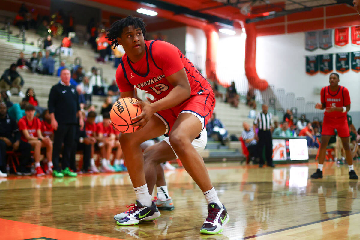 Coronado center Tee Bartlett (13) looks to pass during the second half of a high school basketb ...