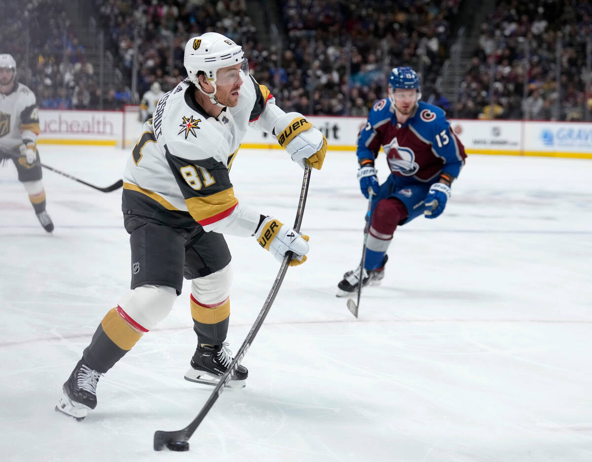 Vegas Golden Knights right wing Jonathan Marchessault, front, puts a shot on the net as Colorad ...