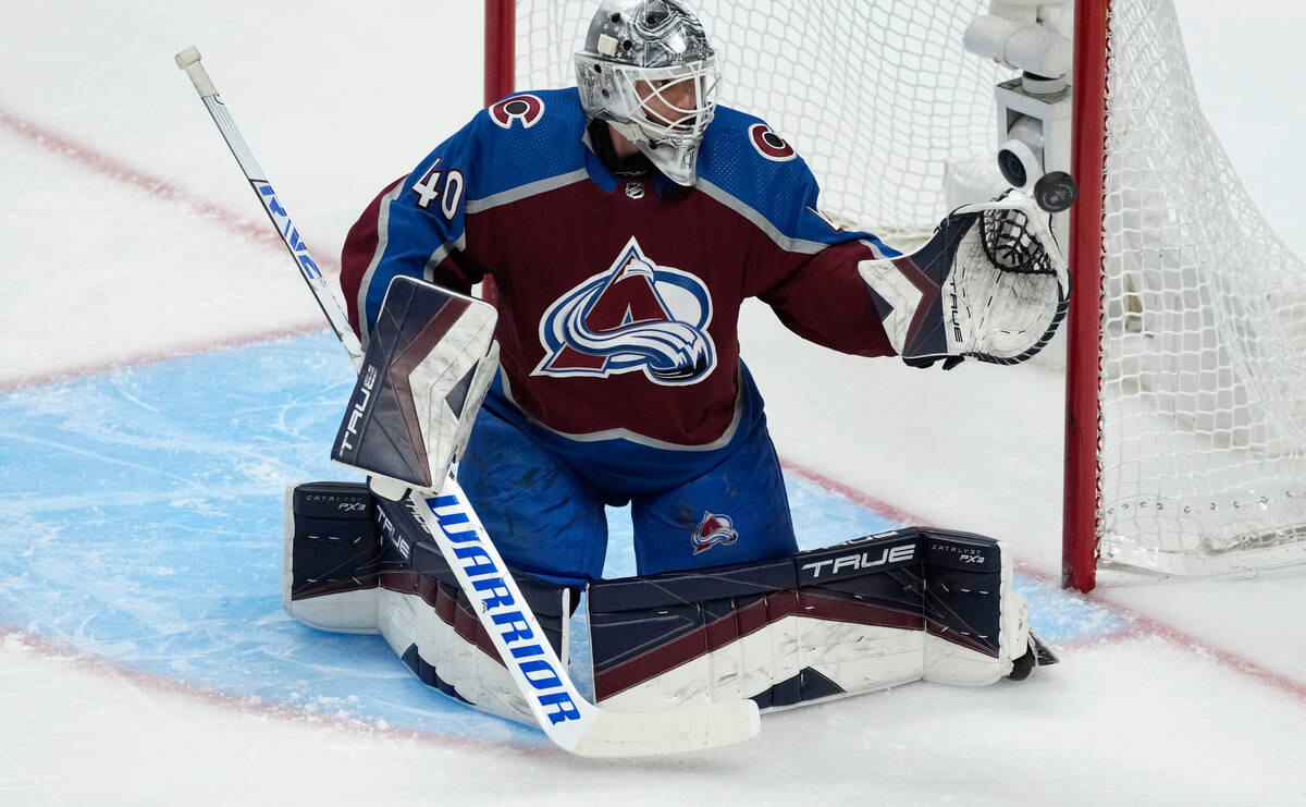 Colorado Avalanche goaltender Alexandar Georgiev deflects a shot during the first period of the ...