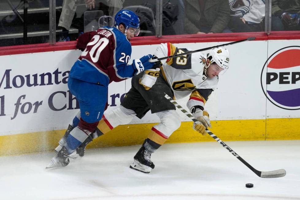 Colorado Avalanche center Ross Colton, left, defends against Vegas Golden Knights center Paul C ...