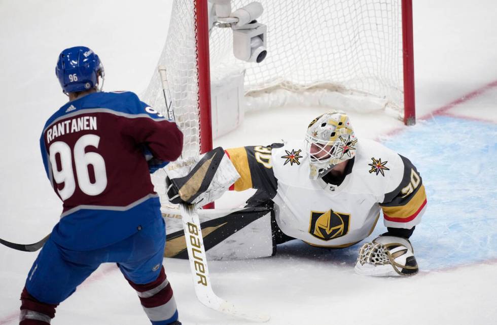 Vegas Golden Knights goaltender Jiri Patera, right, stops a shot by Colorado Avalanche right wi ...