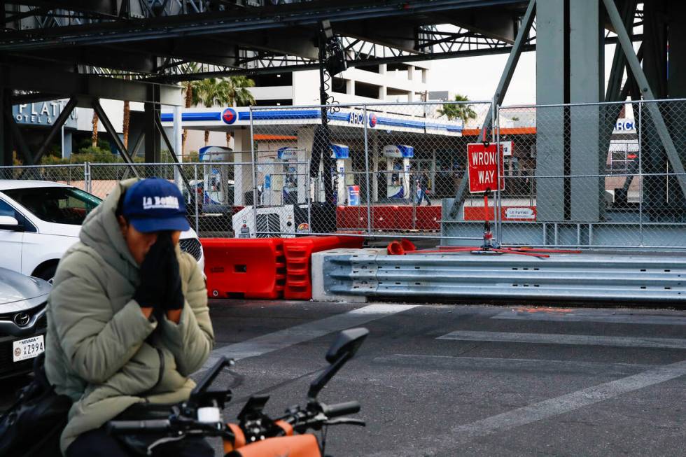 A man rides rides past small businesses near the intersection of Flamingo Road and Koval Lane t ...