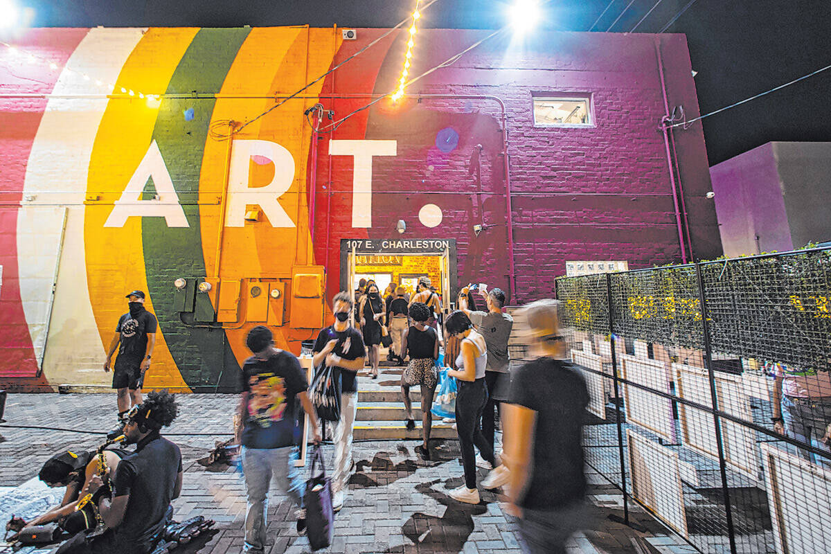 Visitors enter and exit The Arts Factory, where Diamond Sutra Books is located, during First Fr ...