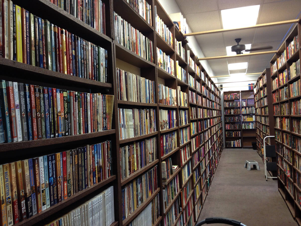 Books are displayed on a shelf at Dragon Castle Books on North Rainbow Boulevard in Las Vegas, ...