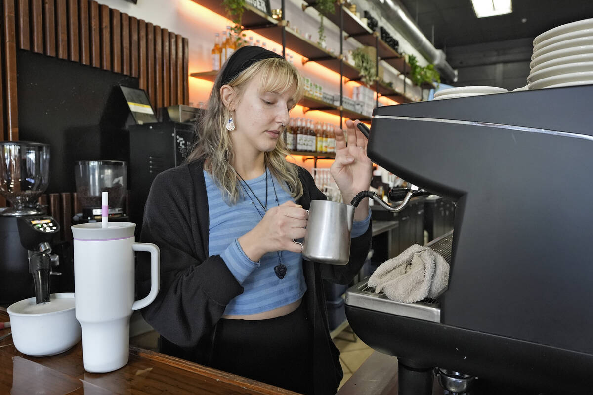 Samantha Grimison makes a cup of coffee at the Blind Tiger Cafe Wednesday, Jan. 10, 2024, in Ta ...