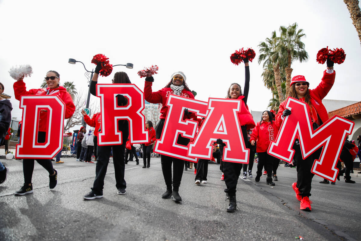 Members of the Delta Sigma Theta sorority walk in the annual Martin Luther King Jr. Day parade ...
