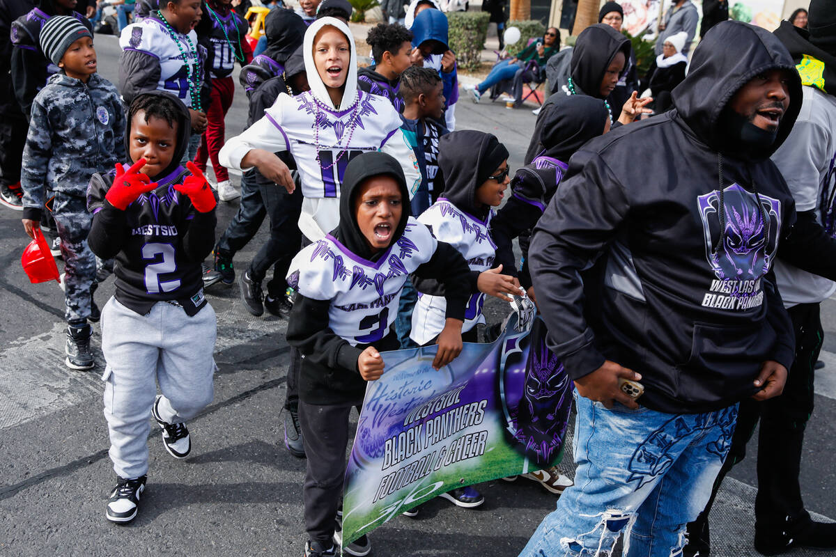The Westside Black Panthers football and cheer team walk in the annual Martin Luther King Jr. D ...