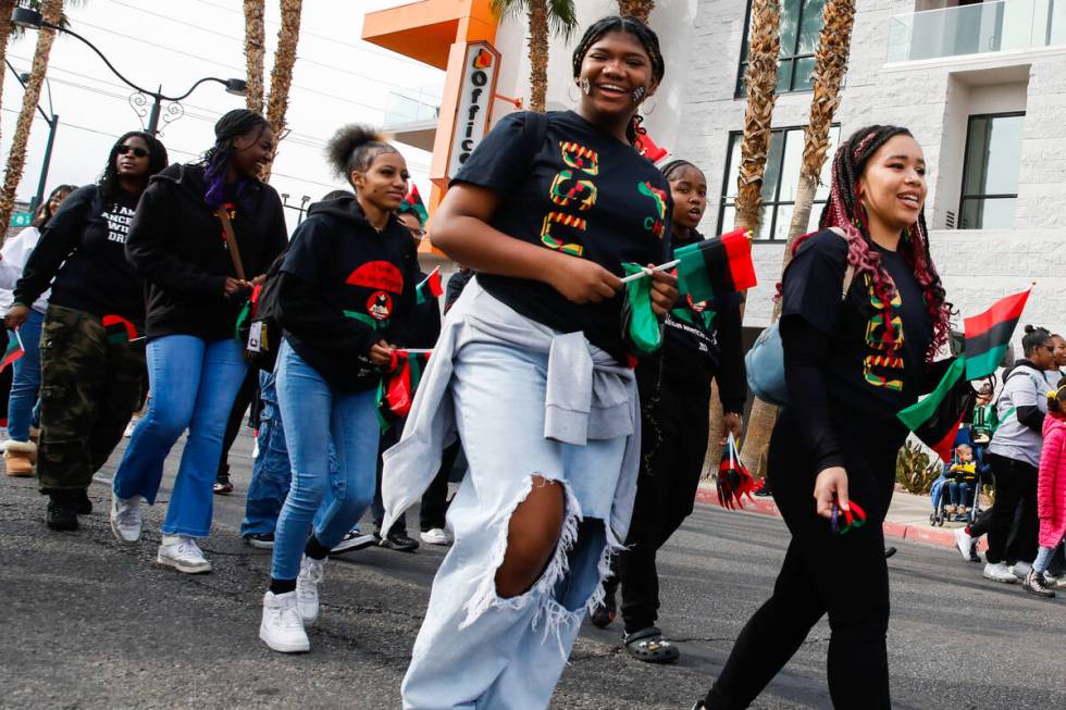 Jayla Thomas, right, and Makayla Burges, members of the Black Student Union Network, walk in th ...