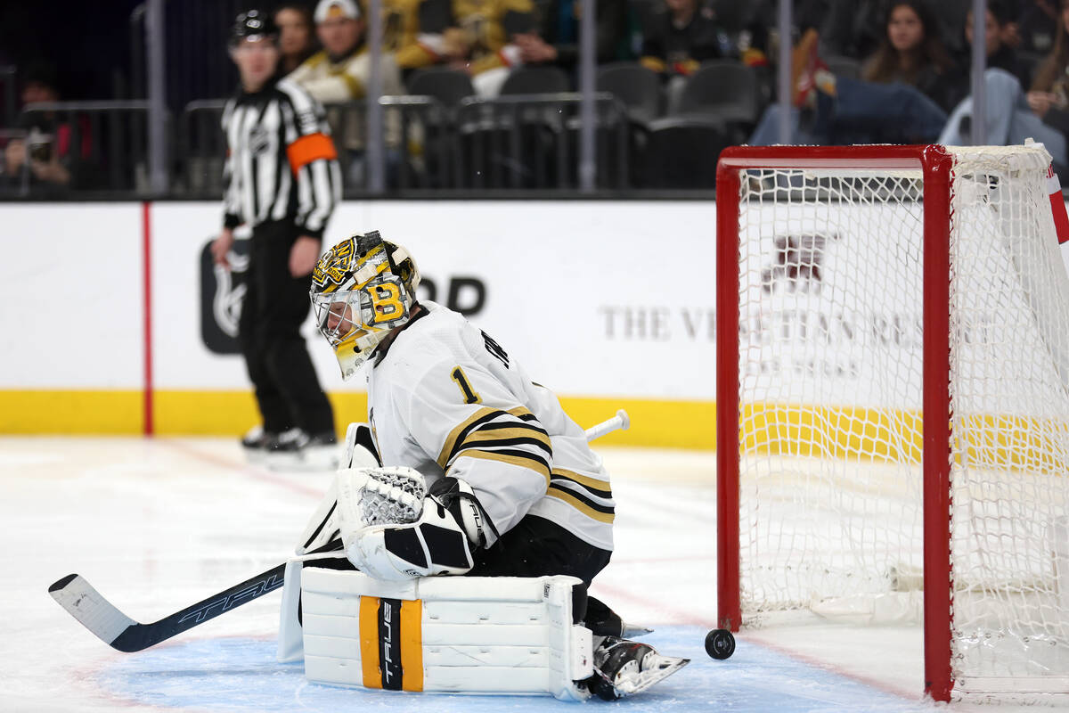 Bruins goaltender Jeremy Swayman (1) lets in a Golden Knights goal during the third period of a ...