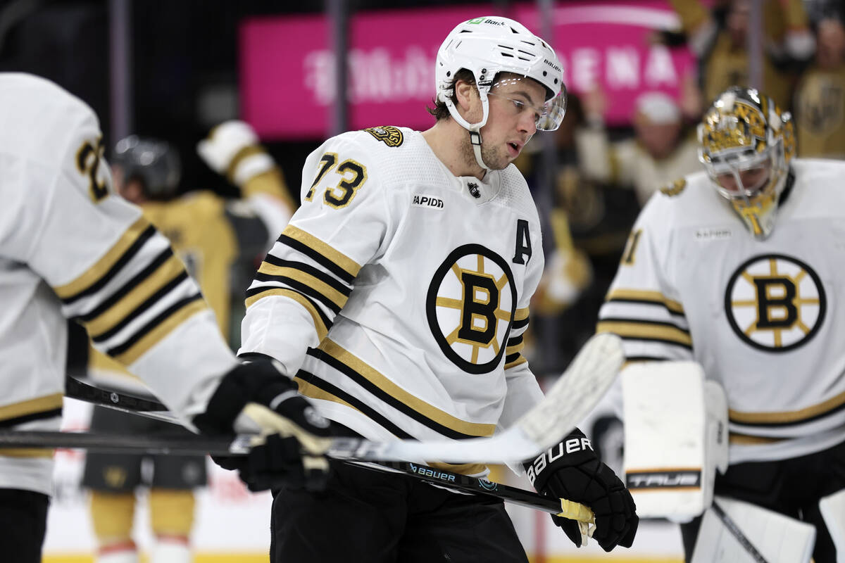 Bruins defenseman Charlie McAvoy (73) reacts after the Golden Knights scored during the third p ...