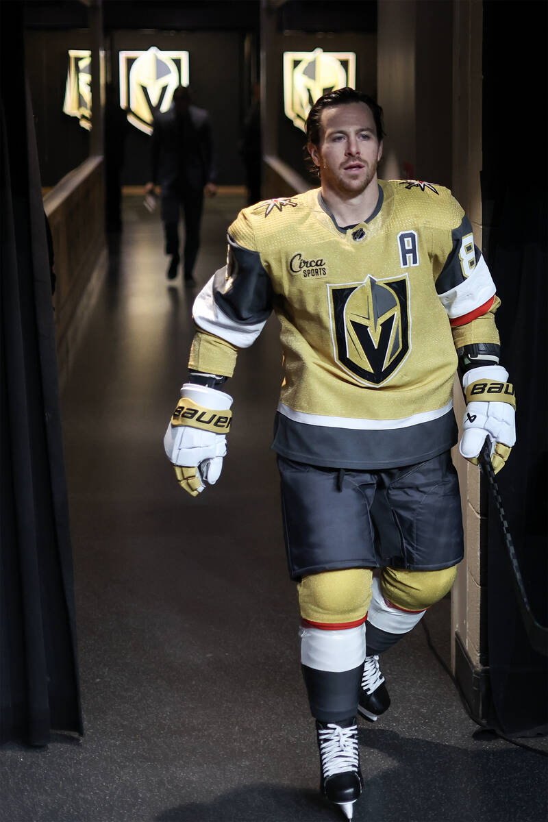 Golden Knights right wing Jonathan Marchessault walks toward the ice for warmups during the fir ...