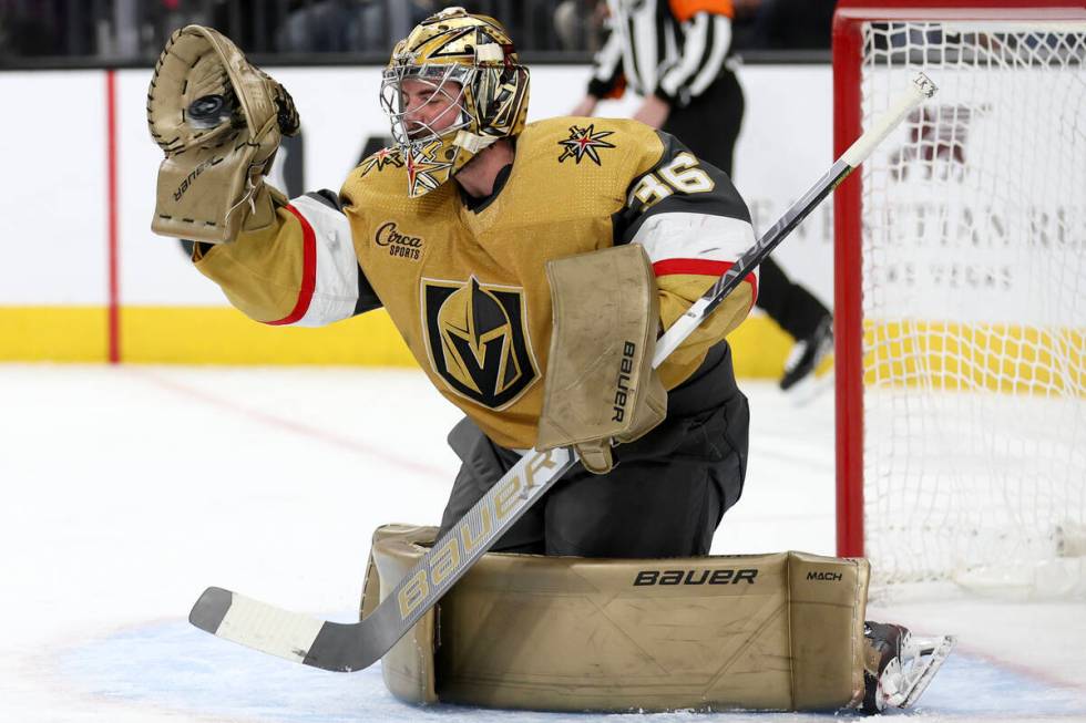 Golden Knights goaltender Logan Thompson (36) makes a glove save during the second period of an ...