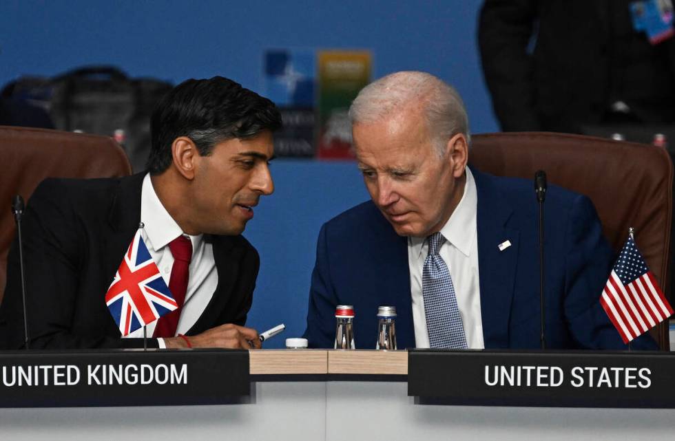 FILE - Britain's Prime Minister Rishi Sunak, left, and U.S. President Joe Biden speak at the st ...