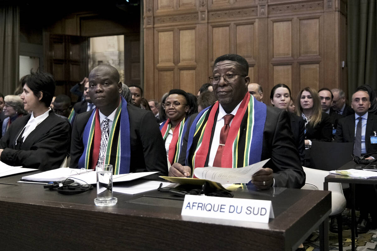 Ambassador of the Republic of South Africa to the Netherlands Vusimuzi Madonsela, right, and Mi ...