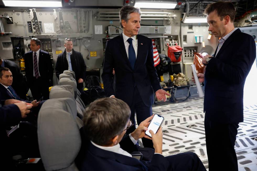 U.S. Secretary of State Antony Blinken, center, stands next to Deputy Chief of Staff for Policy ...